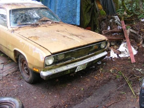 This is on the property I found it on, Final visit before I drove it up on the trailer to get it home.

Note the buckled under fender.