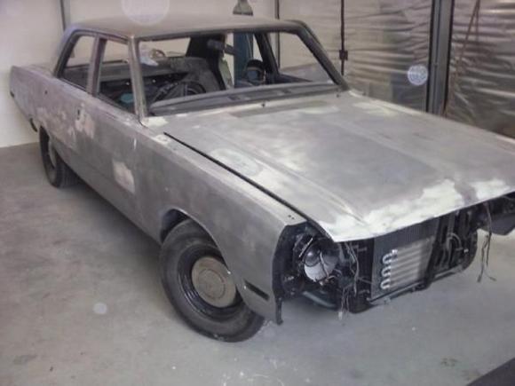 heres my dodge 1970 4 door custom being restored,has a 340 ans 727