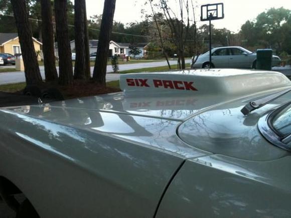 This bird is an original 383 4brl 4 speed car. The last owner removed the single 4brl and installed a six pack setup with this fiber glass hood.