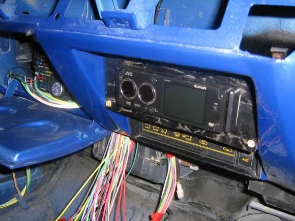JVC DVD player mounted where ash tray used to be.