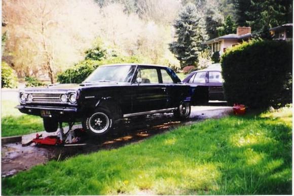 67 Belvedere I. This is the day she dropped her header collector on my face and gave me a bite. You can see the worst of the body damage there on the drivers fender/headlight bezel and some on the bumper support. Patch panels are needed in the quarters but otherwise she's pretty solid. About 1998. Oh and you can see my good gas-mileage (and by that I mean gutless) Shadow I drove too.