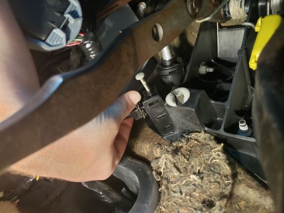 The plug is locked to the switch with a metal spring clip.