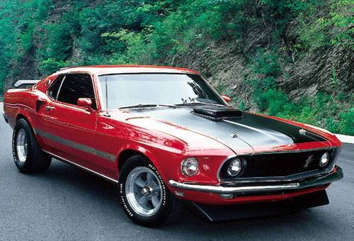 My first love was a younger lady....look at those hips and what a shake..shaker hood that is.  candy apple red, black dayglo stripes, flat black hood stripes, 351-4bb with stick shift...i still miss her 21 years later