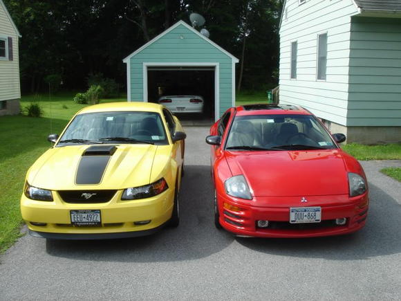 My current 2 cars.  03 Mach 1 and 02 Eclipse GT.  The Z-28 in the garage was sold soon after this picture was taken.