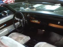 Inside. It has leather seats but after 38 years they are not is the best shape so I use seat covers