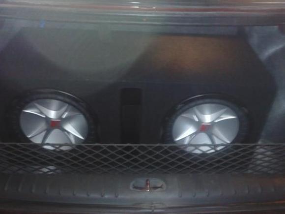 2 12 inch kicker comps with a ported box.  wired to a 1200 watt memphis amp