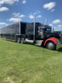 1999 KENWORTH WITH 48 FT STACKER AND PIT AWNING