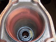 View of inside the rear of the torque tube. I believe the rust has been flung off the rear splined coupler over time.