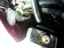 Then tore rubber sleeve around wires inside the car. Notice the melted looking wire upper right.