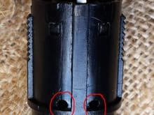 Use a 1/8" drill bit and drill out the 2 nubs on each side where circled.