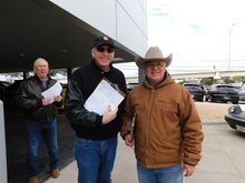 Me (cowboy hat) and my fellow judge, timer in the background.