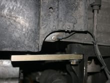 Side view of sway bar hanger attachment bracket.  Picture is misleading - it's actually almost perfectly horizontal.