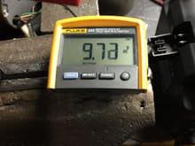 9.72VDC at starter post on solenoid, indicative of very small voltage drop across contacts.