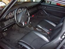 Black interior with Carrera S accents, great condition. Have since put colored Porsche badge on steering wheel and aluminum pedals. Aftermarket Kenwood CD radio also.