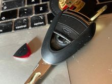 Key with errant button next to it.