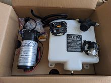 WMI AEM 30-3350 kit PLUS an in-line filter and the solenoid to prevent backflow or any suction of water/meth under vacuum or whatever. 