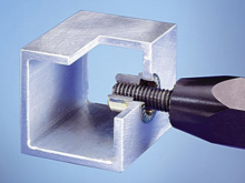 Installation from the outside surface, the rivet tool compresses the body of the insert clamping it in the hole.