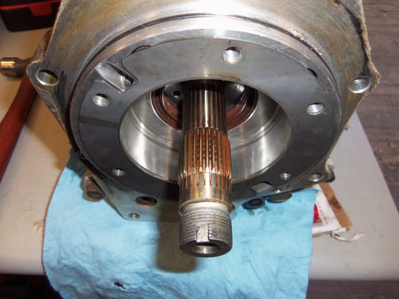Splines on transmission output shaft engage the female splines inside the pinion gear.