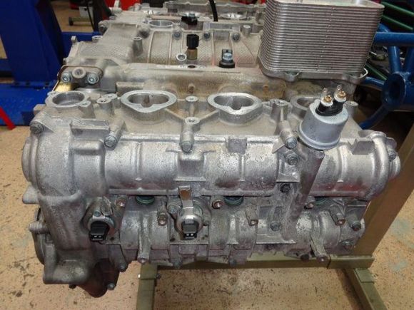 Top of the engine. The oil cooler and oil-pressure sensor are visible.