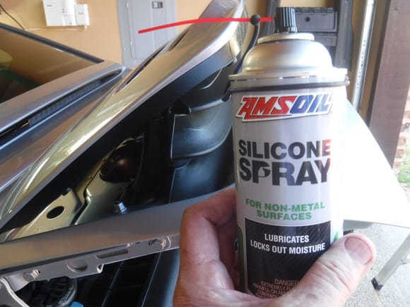 Apply silicone lube to drive arms at both ends of spoiler and that groaning noise vanishes.