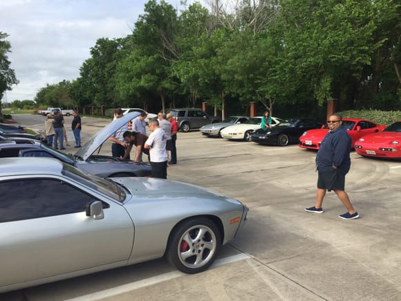 Peter strollng across the parking lot to join the conversation