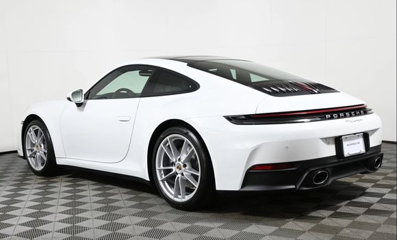 Actual 992.2 example in white.  These are base wheels (I know, the shame). My rear badge is gloss black. 