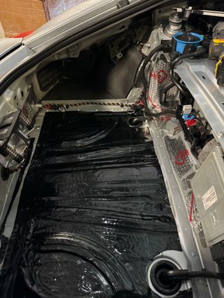 Trunk with silver pieces on small areas and large black piece on trunk base.  You can also see the matte black foam on the side behind the wheel.