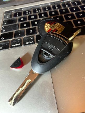 Key with errant button next to it.