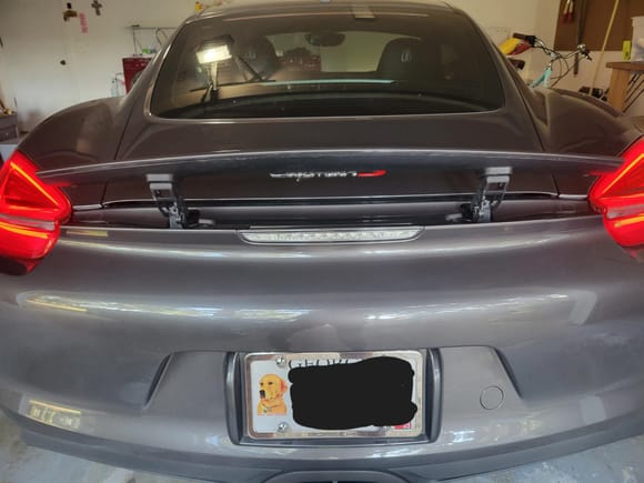 Rear spoiler up! Automatically comes up around 78-80 mph or can be manually deployed at any time.