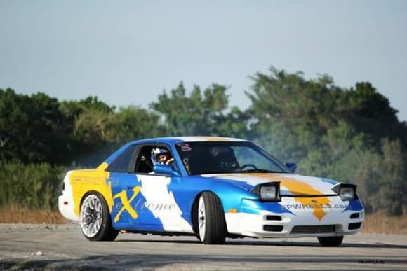 This is the company drift car. It is a 240 sx with an SR 20 motor