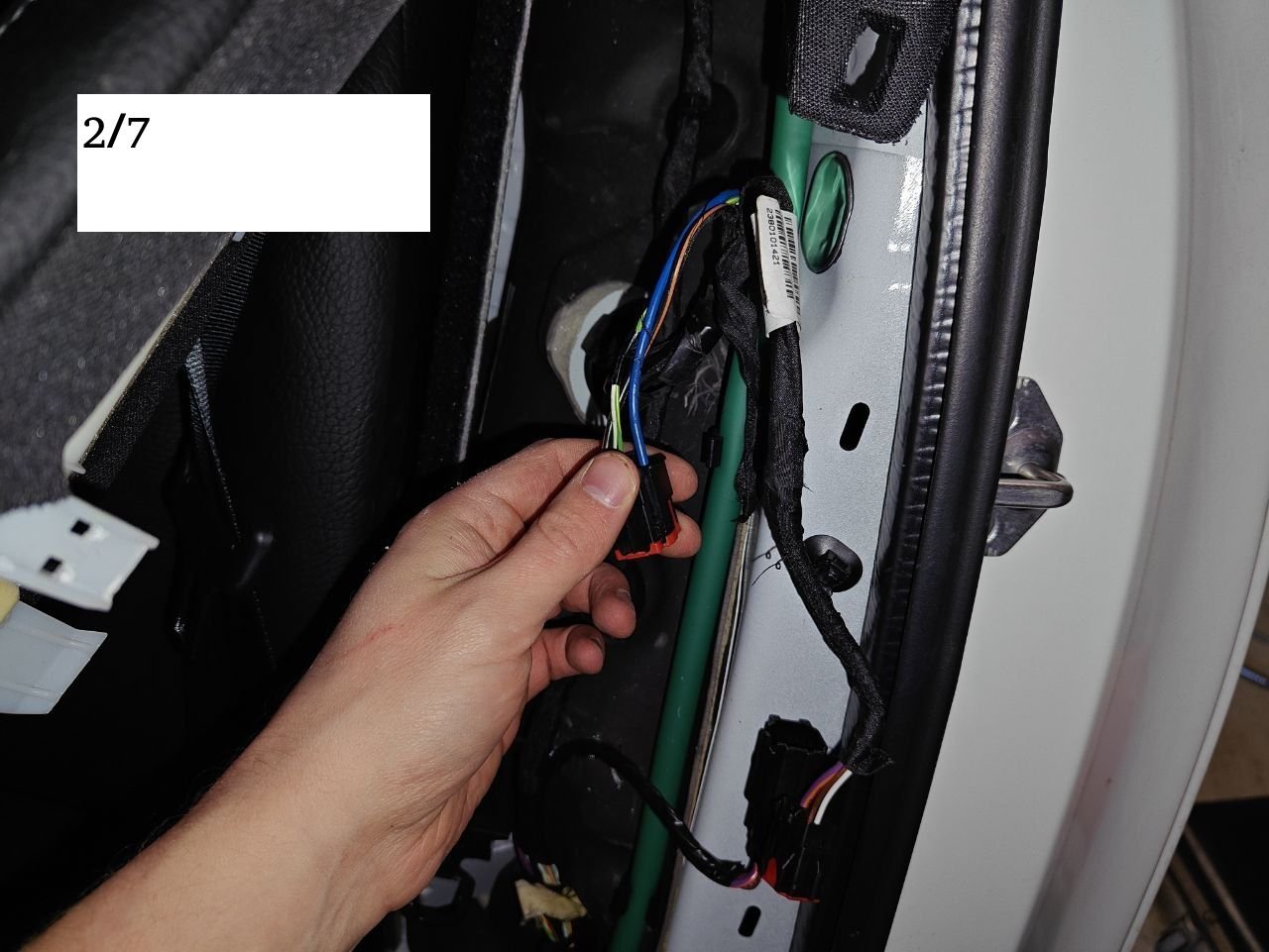 2/7 plug inside car beside left rear seat