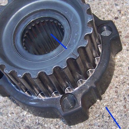 This is the cropped crankshaft timing belt pulley as viewed from the side that faces towards the engine.
the blue lines point out the timing marks both on the inside face of the pulley (not very helpful as it gets hidden during installation) and the outside tab, which is really hard to see when the pulley is installed unless the accessory belt pulley is removed.