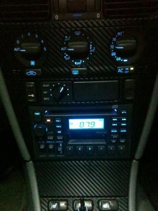 Center console and radio. I also put some DiNoc carbon fiber vinyl on instead of the wood grain