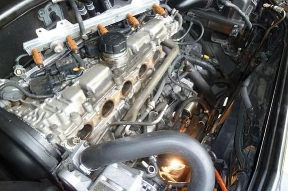 Front view of engine compartment after taking off the minimum of what I needed to remove in order to replace the PCV system.  Still was tight working when it came time to put the ETM back.  But workable...