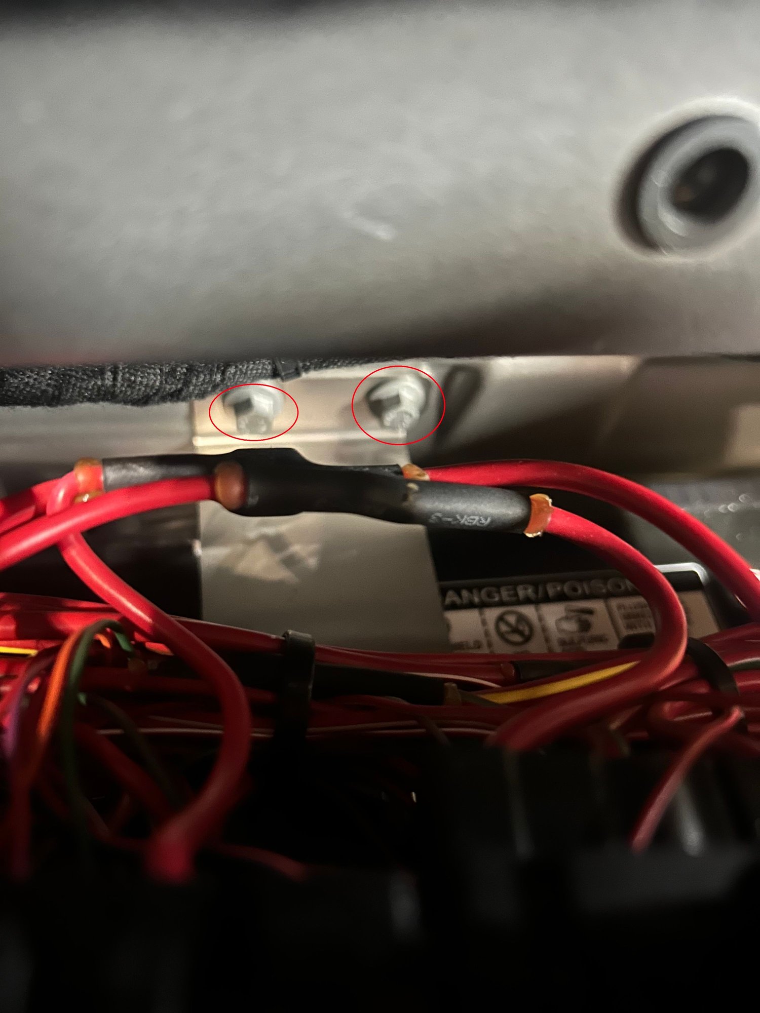 Back battery bracket 10mm bolts. Access with long extension.