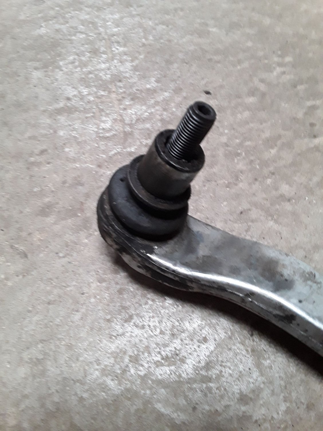 Lower control arm ball joint with top hat bush attached. 