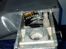White/clear plastic arm slides based on the lock position.  Magnets (polar specific) trigger the start/stop via the on board hall sensors.