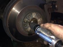 Drill the soft alloy head off .