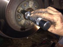 There is a alloy retaining screw to orientate the disk holes with the hub holes .It’s actually simply the wheel lugs that as well as holding the wheel on , hold the disk on .Theses were ceased and chewed up with any force .Even with an impact drive shown .