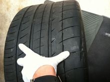 Left rear tire w/ gash and nail puncture. Replacing this tire w/ brand new Mich PS2.