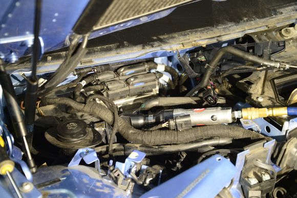 Remove the plastic cover right below the windshield to expose and disconnect all electrical connectors going to the engine. Oh, I forgot to mention, before I started, I disconnected both negative cables to my batteries.
