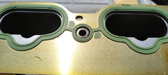 Lining up 2 Manifold Isolator bolts around the gasket ridge holds it in place for installation