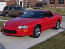 2002 Camaro B4C Special Service Coupe.  One of 18 red, six speed cars - may be a one of one Camaro with the unusual B4C options of chrome wheels and Hurst shifter.  Currently has 12,000 miles on the odometer