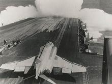 Heavy seas on the USS Midway.  Man, that was a miserable day...Yeah, we are launching aircraft under these conditions.  Where's the Air Force?