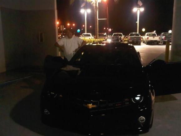 My dad getting into my brand new car, right after I finished with financing and they just finished cleaning it.