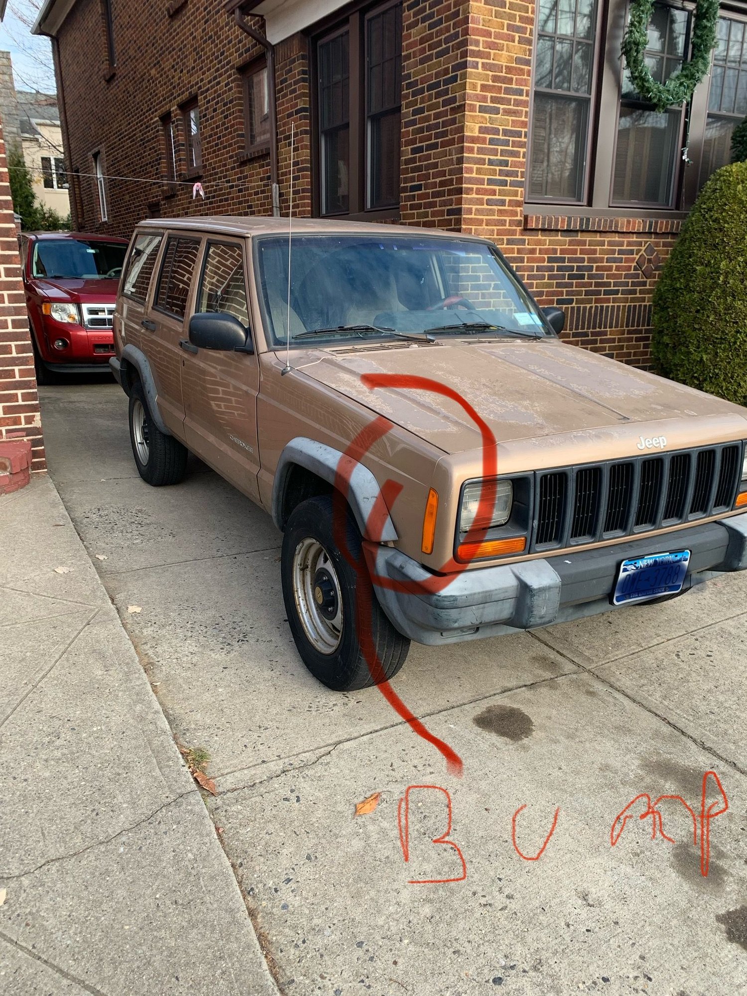 It has a small bump in the right front side panel. Since of the day I got it in 2011.