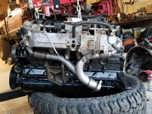 Remove heat shield from engine mount.
