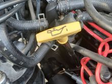 Engine oil dipstick handle.