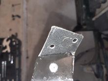 I attached it with a rivit and drilled two holes for bolts