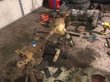 Disassembling the axle. Transmission/T case in the background. 